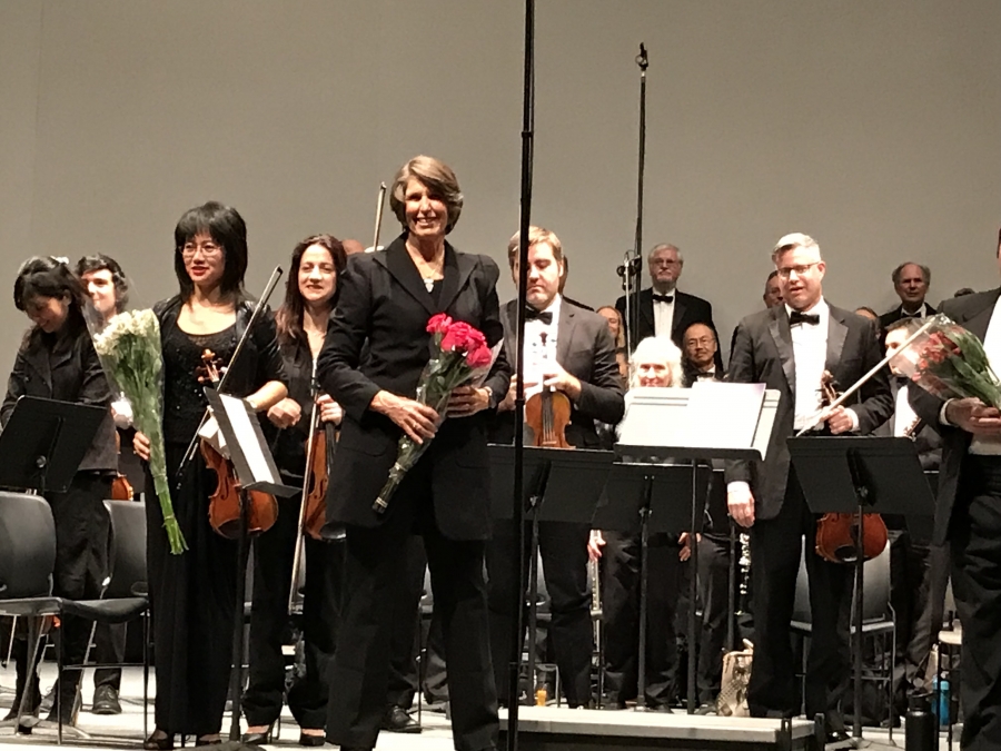 Nancy Noble Holland with the orchestra she conducted